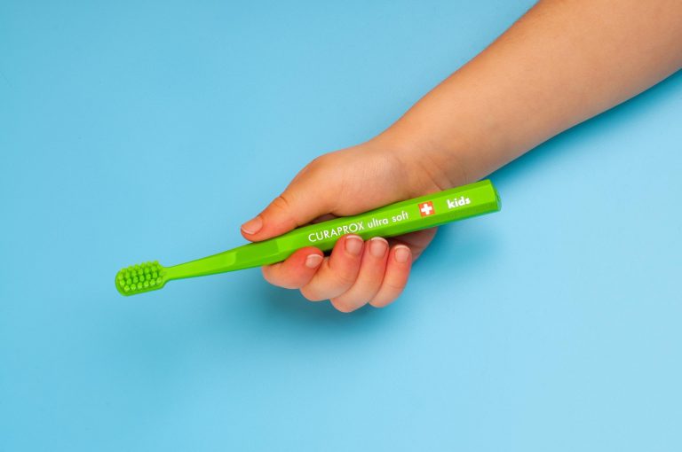 Kids-toothbrush-hand-768x510.jpeg